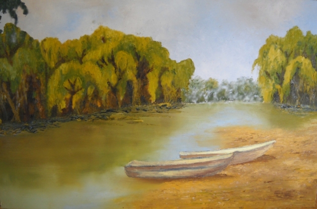 Boats on river with willows
